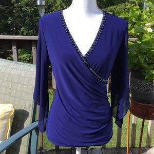 db size S striking surplice blouse with rhinestones in a rich navy blue